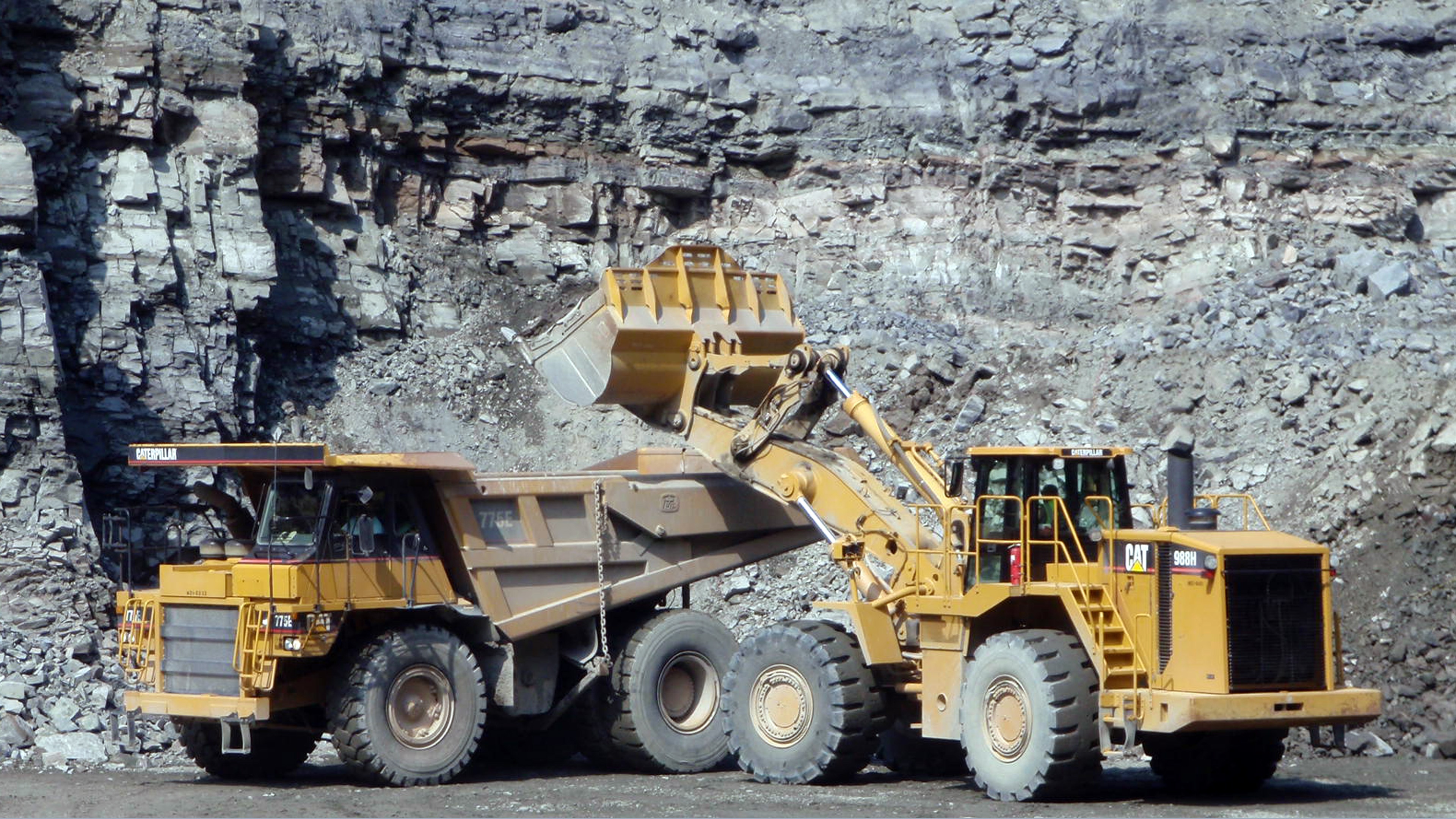 Luck Stone Loaders in front of a quarry.